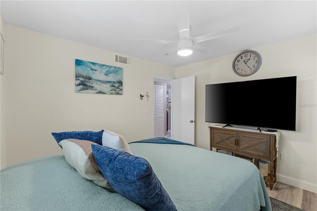 Bedroom also features laminate plank flooring