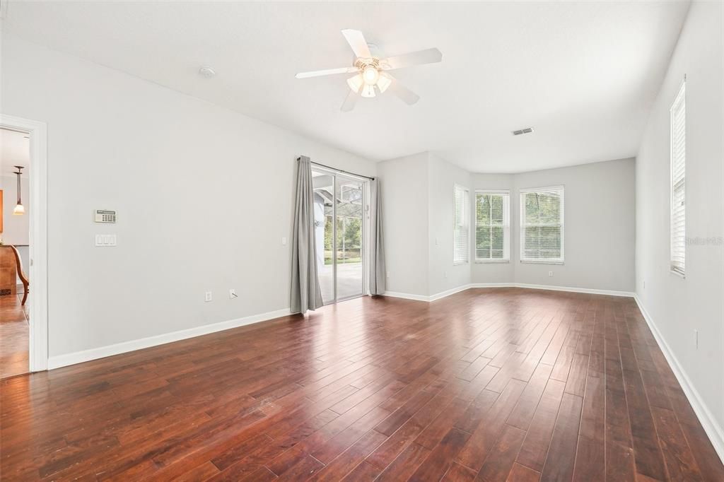 Primary suite with private lanai access & enough space for a reading nook