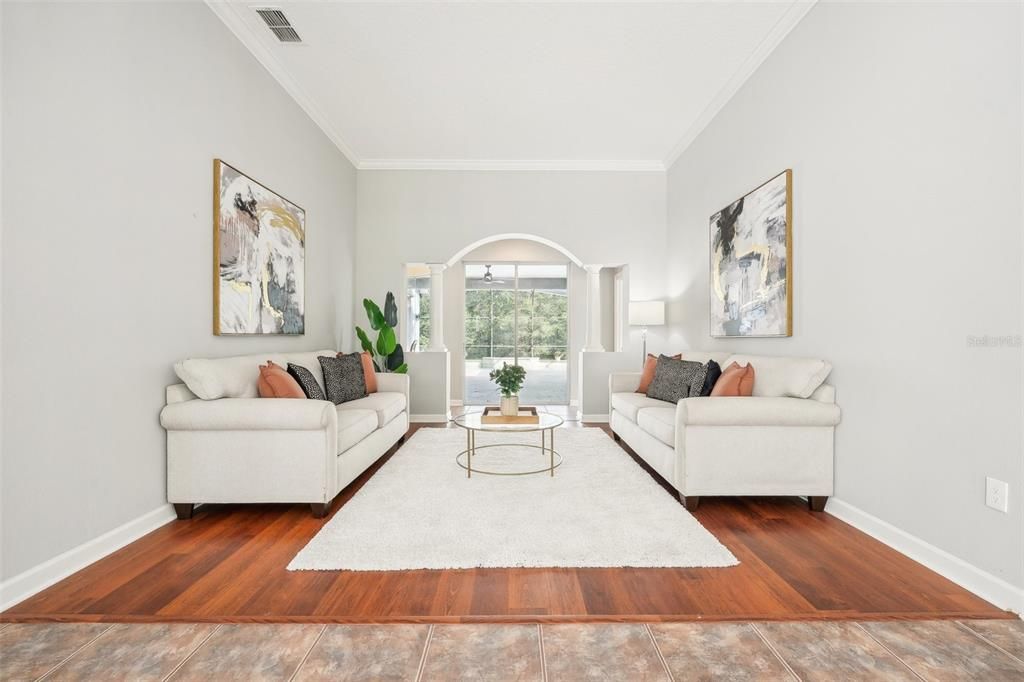 Formal Living Room overlooking the stunning backyard!