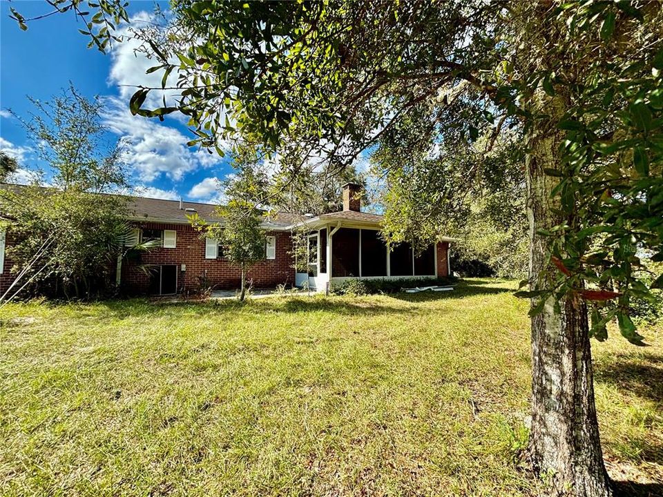 Back of house with screen porch