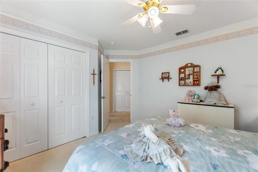 Large linen closet in hall between guest bath and den