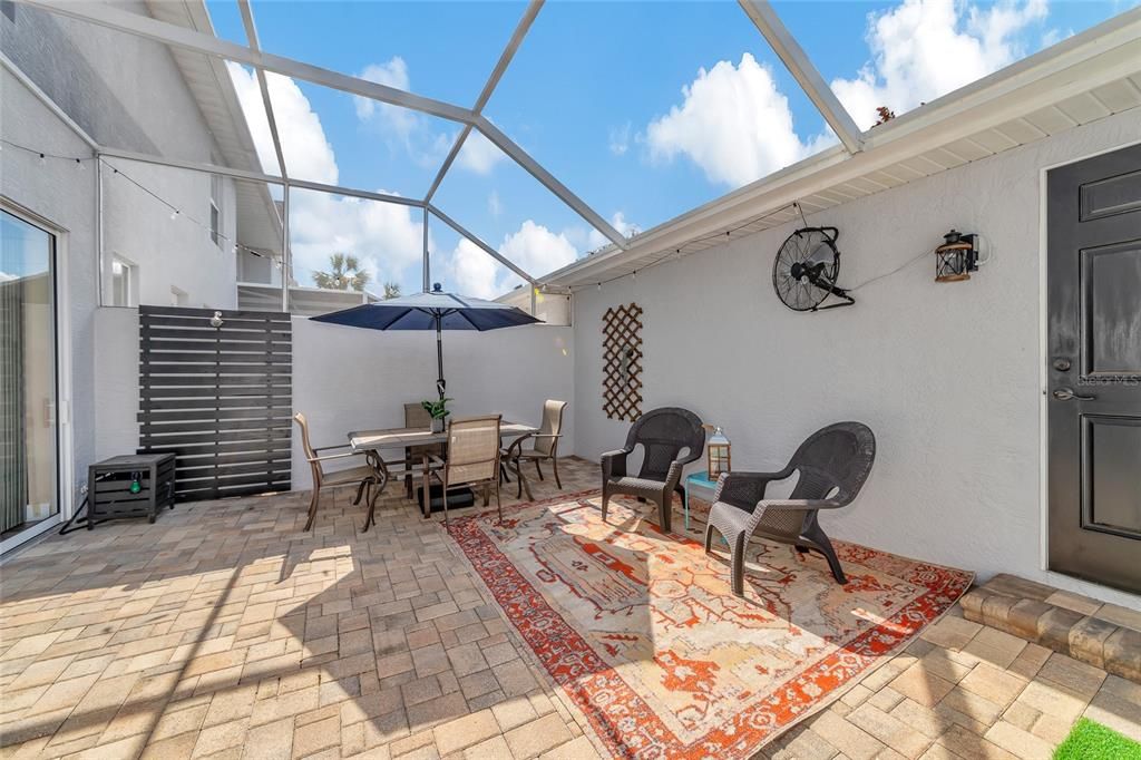 Large screened patio with brick pavers