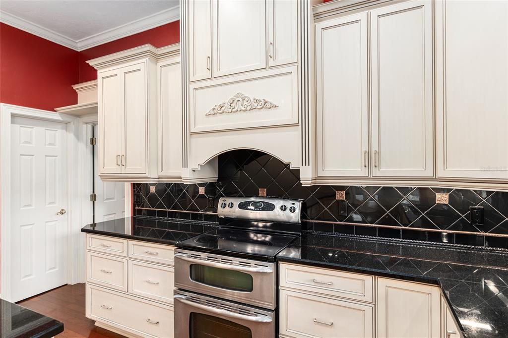 GRANITE COUNTERS AND DESIGNER BACKSPLASH