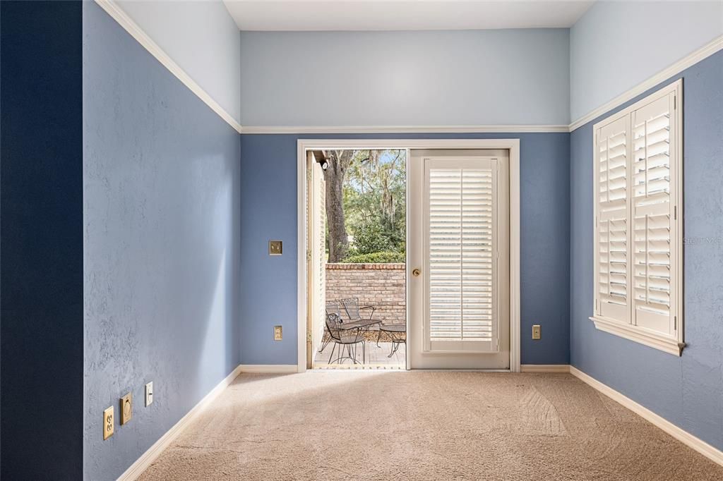 SITTING ROOM AREA IN OWNER'S SUITE WITH DOORS TO COURYARD