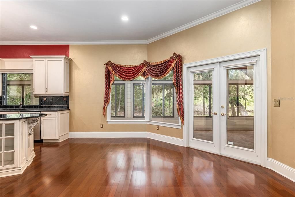 ANOTHER VIEW OF BREAKFAST NOOK AREA AND DOORS TO LANAI