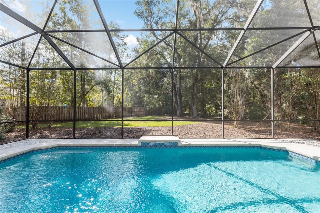 POOL OVERLOOKS SIDE YARD