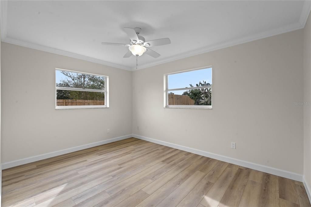 Secondary bedroom with views of the backyard