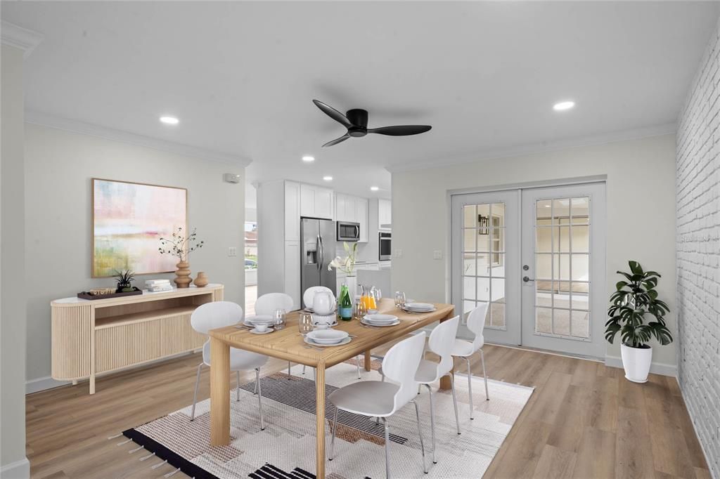 Dining area with french doors out to the spacious covered, screened patio