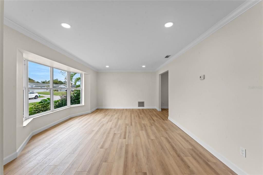 Living area showing the opening that leads into the kitchen