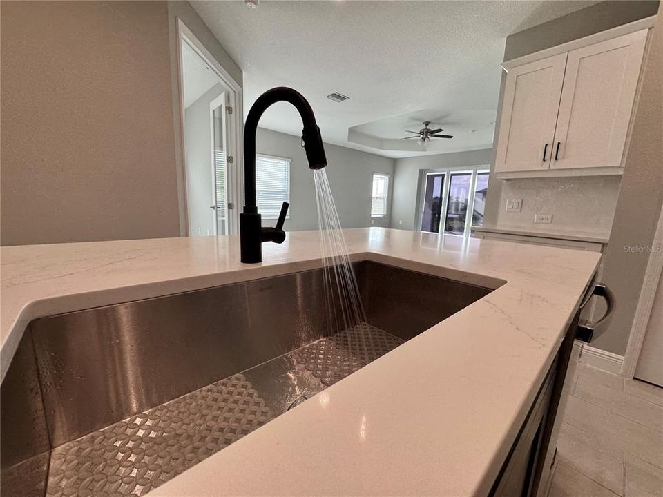 Quartz counters with modern faucet