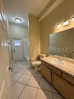 Second bathroom with a bathtub shower and has additional door that opens to the backyard.