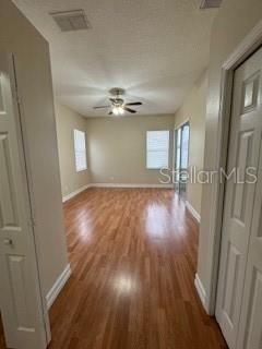 The master bedroom is perfectly situated away from the other 3 bedrooms with a walk-in closet and sliding glass doors.