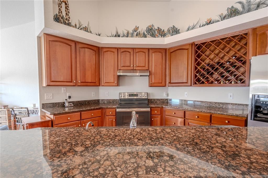 The wood cabinetry features a wine rack.