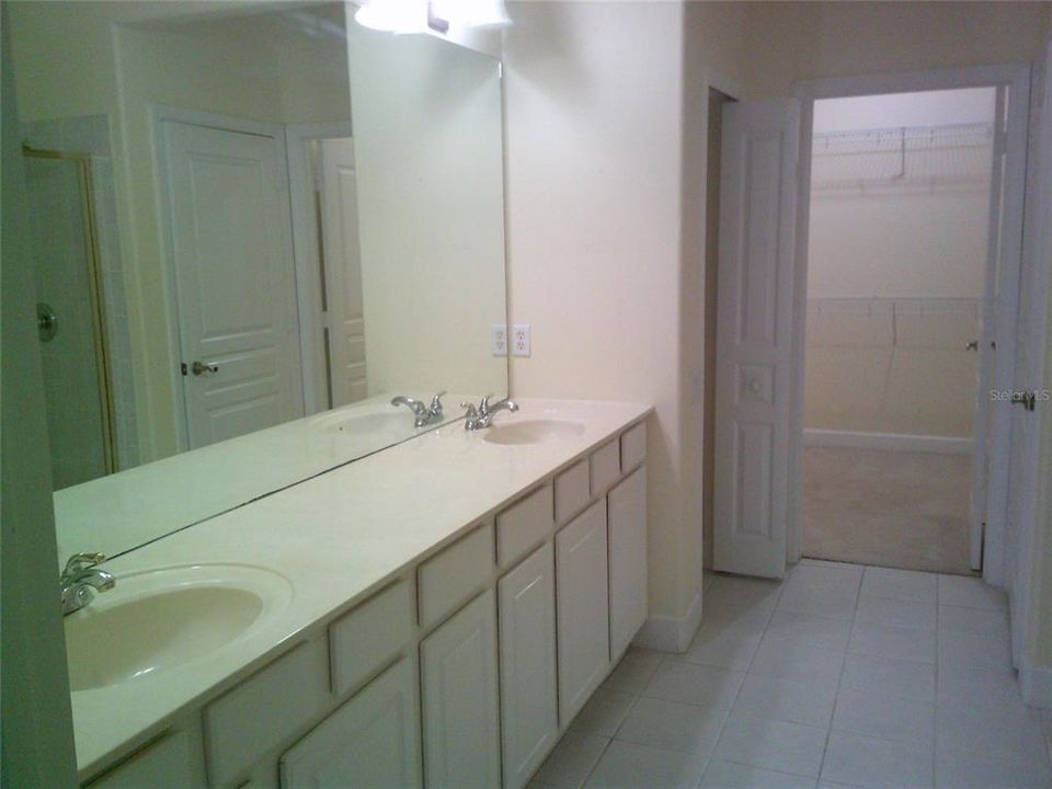 Primary Bathroom Dual Sinks and Closet