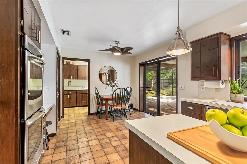 Dinette area and sliding glass doors to patio/pool area