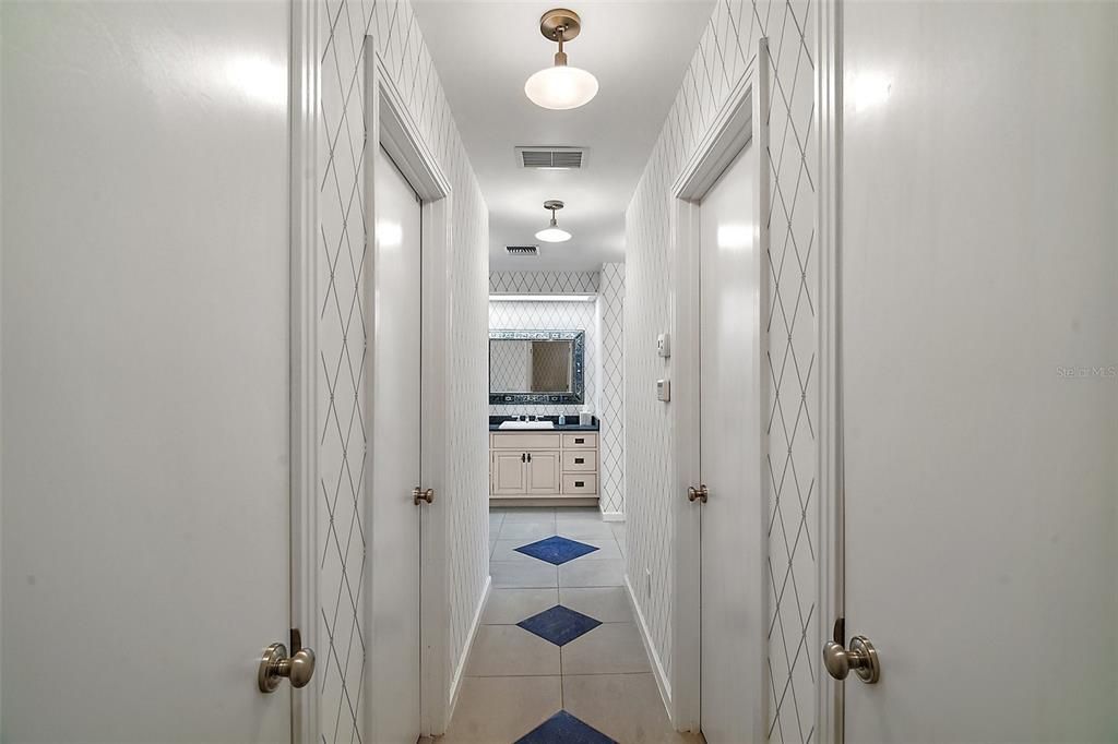 Hallway to master bath w/double walk-in closets