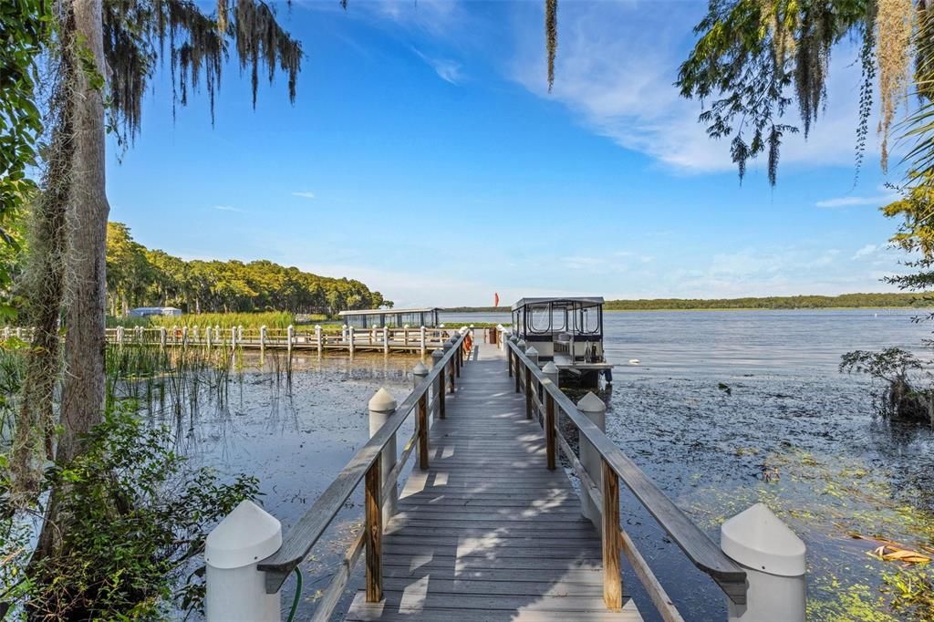 Community pontoon boats for tours of Lake Tarpon with a stop at a lakefront resturant for lunch~