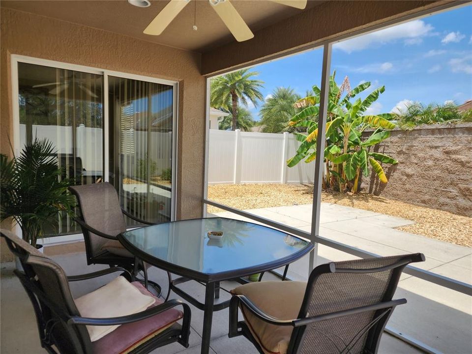 Covered and screened-in lanai with sliding glass doors leading out from the Owner's suite and living room