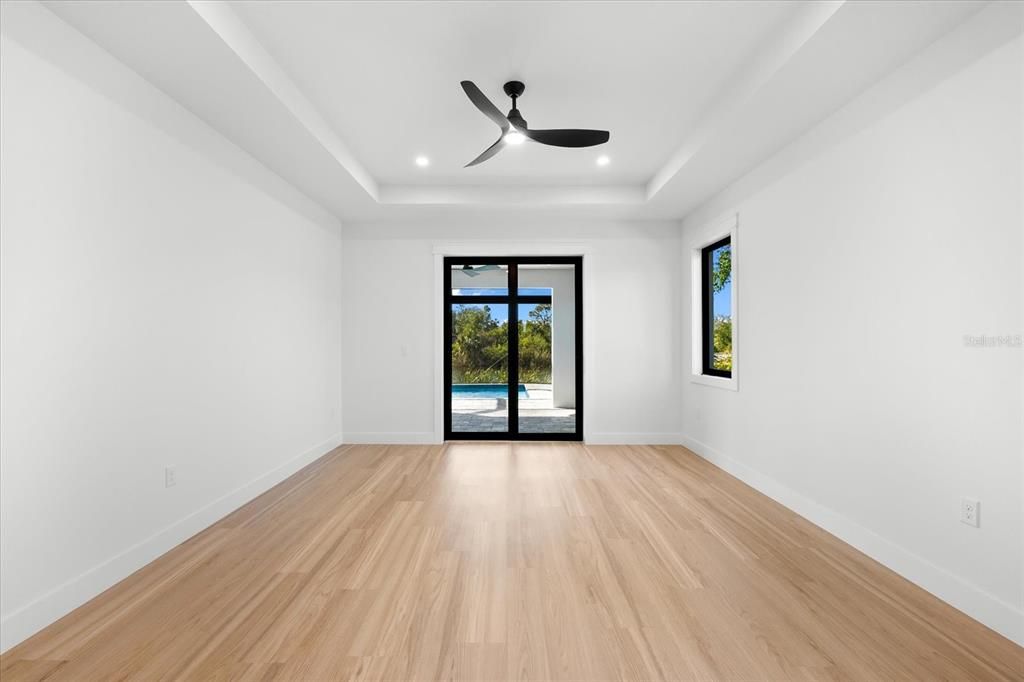 Primary Bedroom Featuring High Ceilings