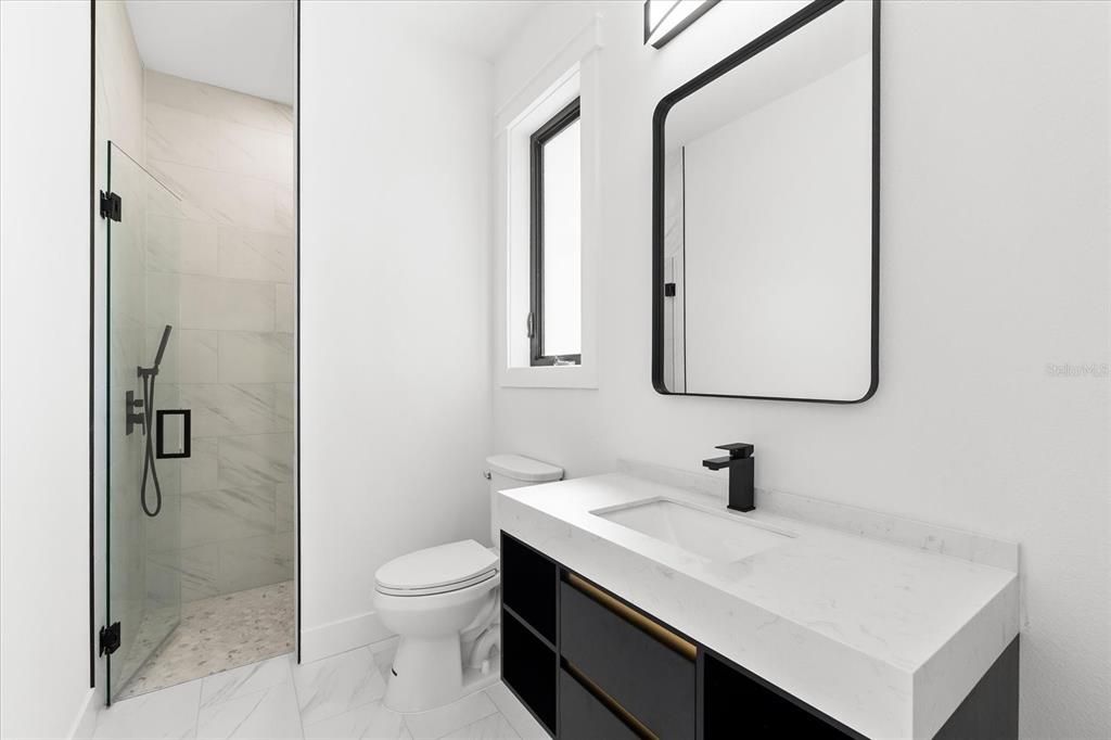 Bathroom #3 with Shower and Built-in Shelving