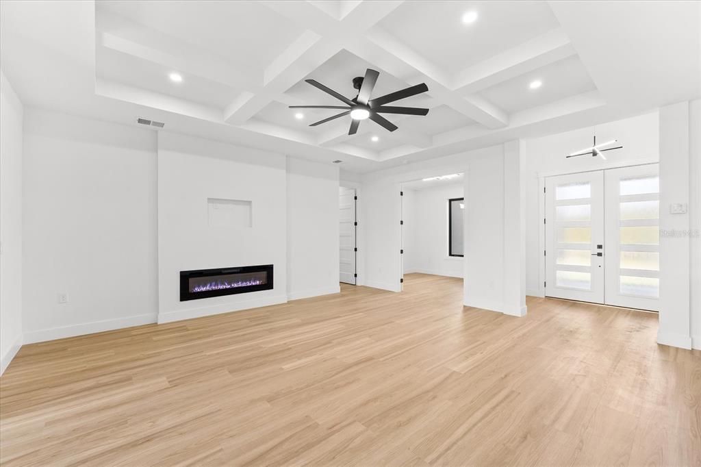 Spacious Great Room Featuring Coffered Ceilings