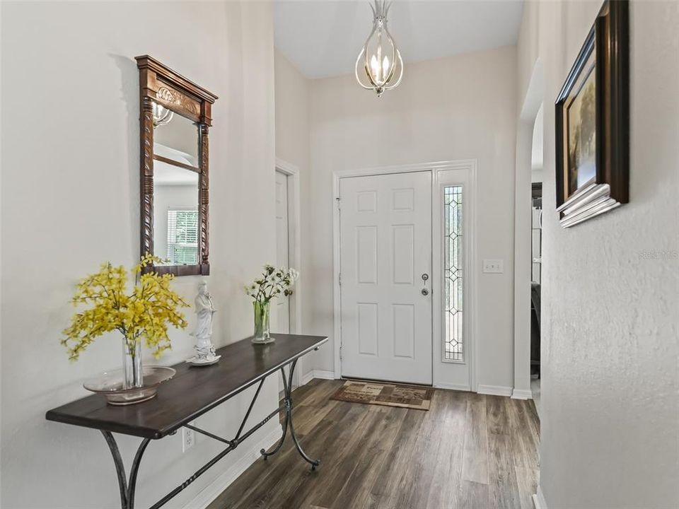 Foyer w/Elegant light fixture & Luxury Vinyl Plank flooring