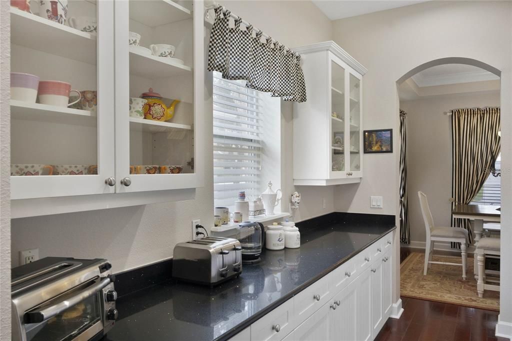 Butlers pantry area connecting to Dining Room and Walk-in Pantry