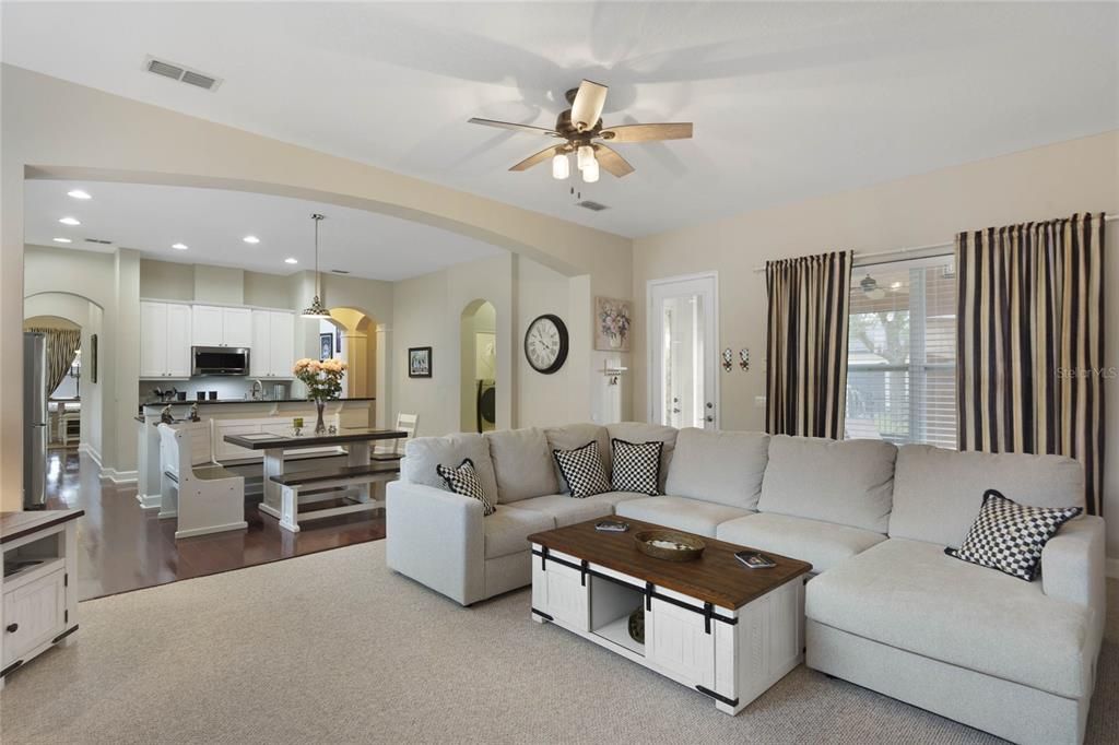 Family room and door to screened patio and fenced backyard