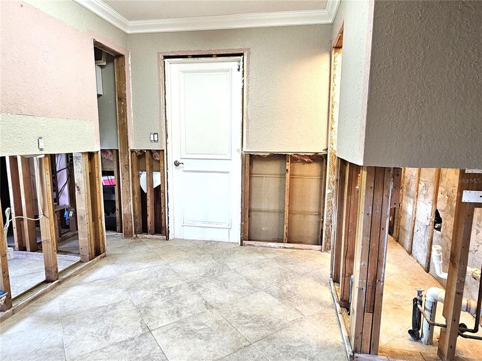 Laundry Room View 2- Door to left goes into Half Bath, Washer & Dryer go in the alcove to the right!