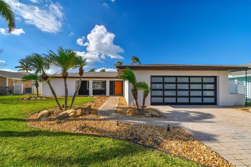 Beautifully Landscaped, Waterfront Home with lots of Curb Appeal on Boca Ciega Bay with fabulous Northwest Views!!!!