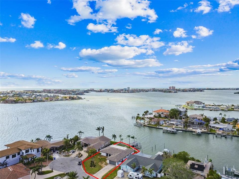 This beautiful home is 2nd from the end of a finger on Boca Ciega Bay and is just north of the Madeira Beach Causeway shown in the background!!