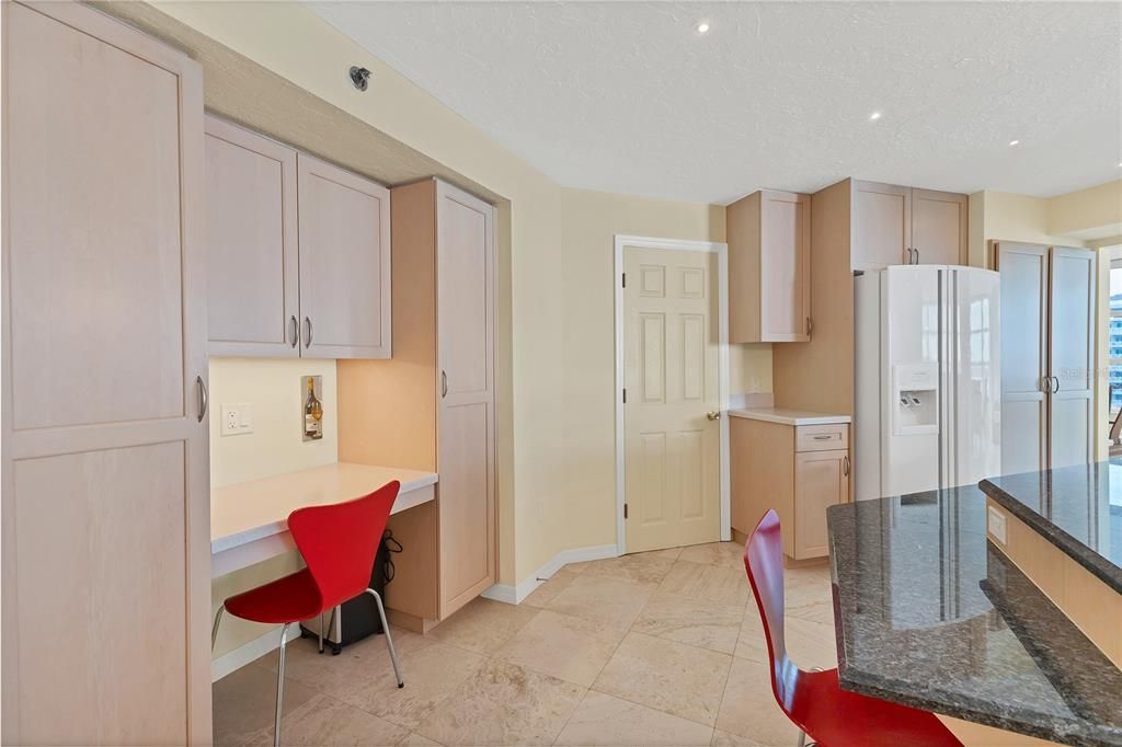 Work station in the kitchen makes this space multifunctional.