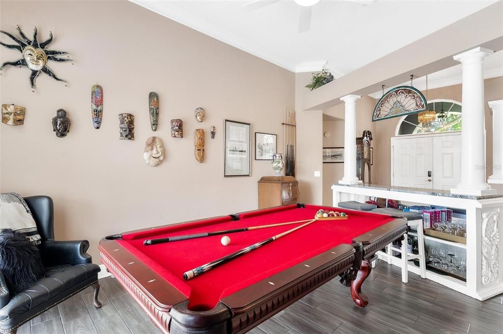 Living Area being used as a Rec Room with Pool Table and Custom Bar