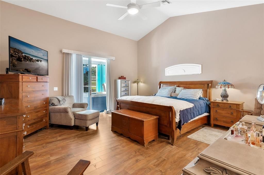 Primary Bedroom with Sliding Doors leading to Lanai and Pool Area