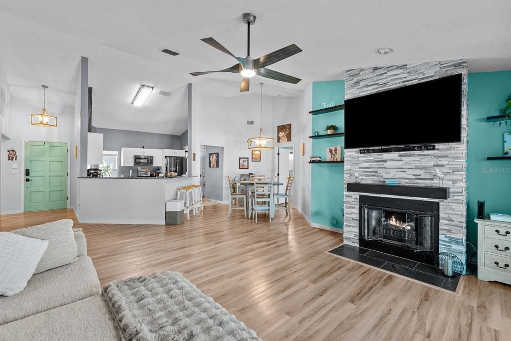 Living room area with view of kitchen and dining room