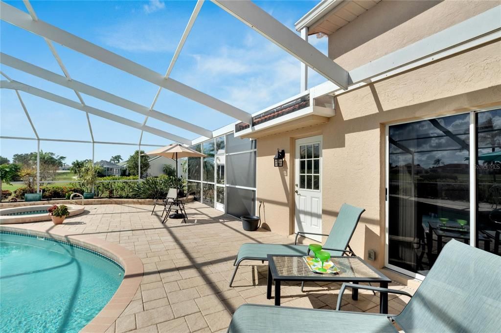 Shaded covered porch with two ceiling fans.