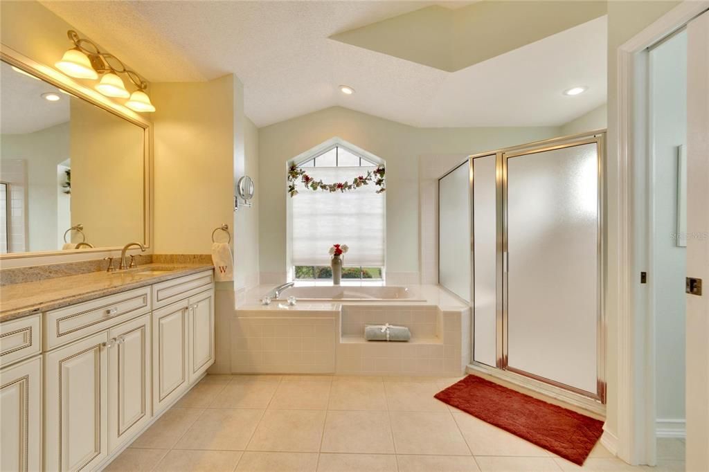 Dual sinks, Garden tub, and step in oversized shower.  Bathroom one measures 10x11 approximately.