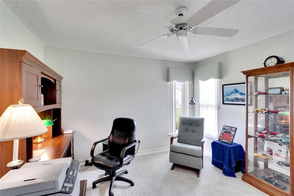 Bedroom number two currently is being used as a home office.  Both second and third bedrooms have a standard reach in closet. Room measures 12x12 approximately.