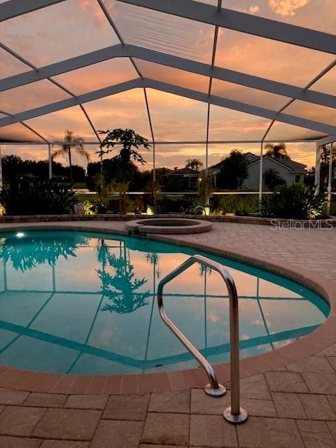 Large screened in, heated pool and spa lanai.  Plenty of room for all outdoor activities. Saltwater, solar heated with electric heat pump for spa.  Pool can be controlled off of an app on your phone.  Current owner are going to leave the pool sweep to aid in cleaning.