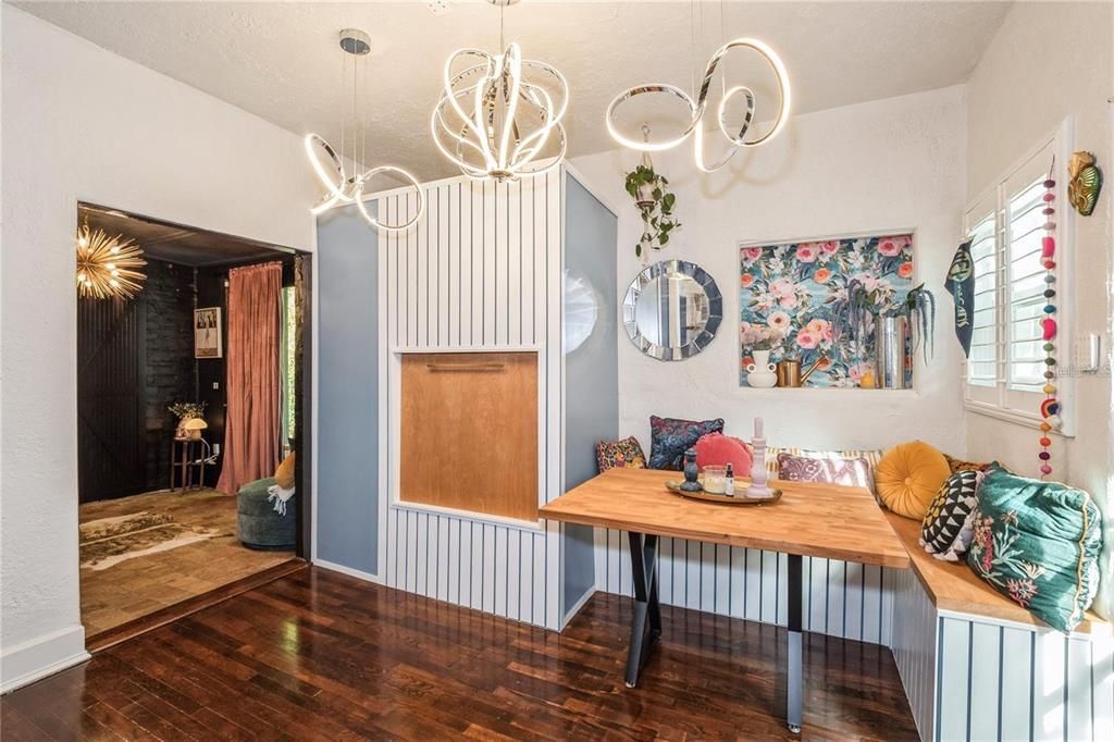 The beautifully remodeled Kitchen features Silestone Countertops, Marble Backsplash, 6 - burner gas range (natural gas), All-Stainless Steel Appliances, Live Edge Wood shelving & a Quaint Breakfast Nook Area!