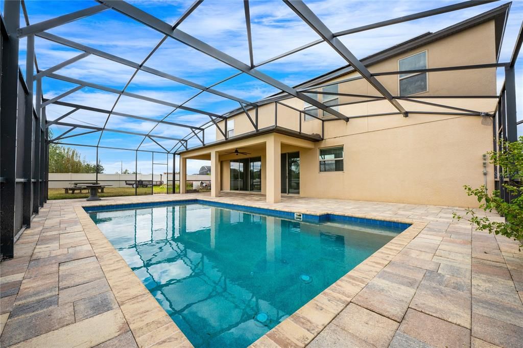 Lanai and pool are screened and overlook an expansive fully fenced yard!