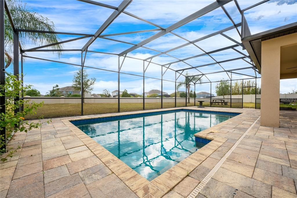 Your screened pool overlooks a huge fully fenced backyard!