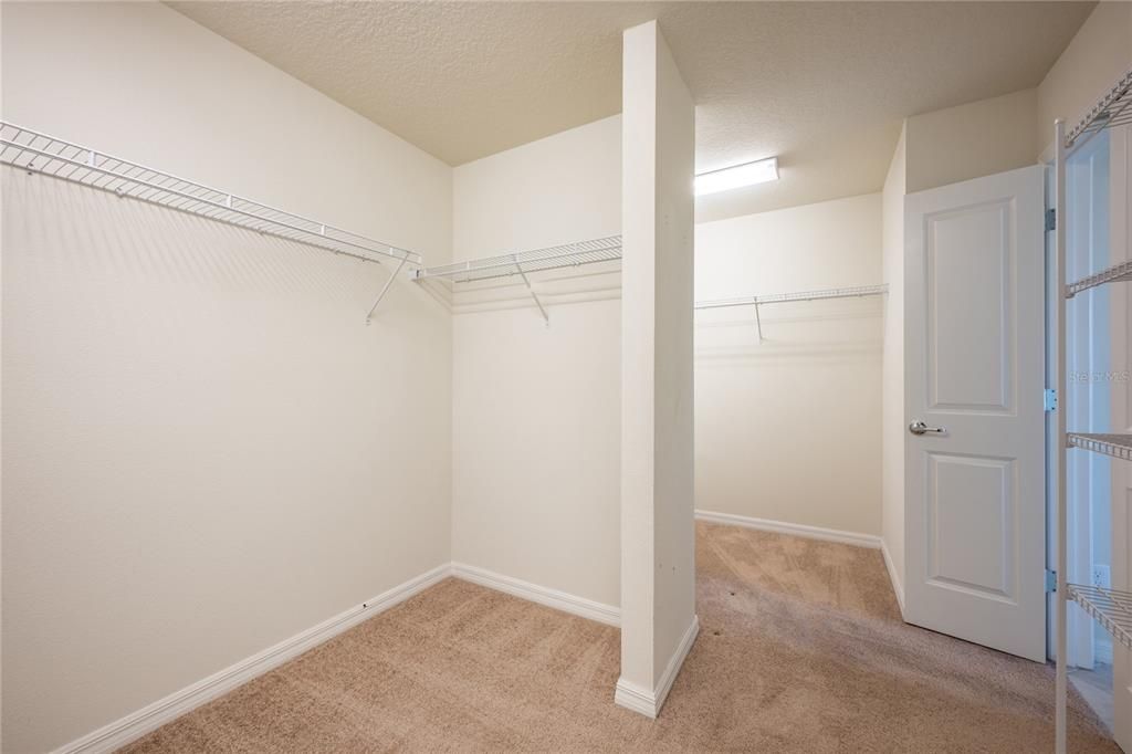 TWO SIDED WALK-IN CLOSET.