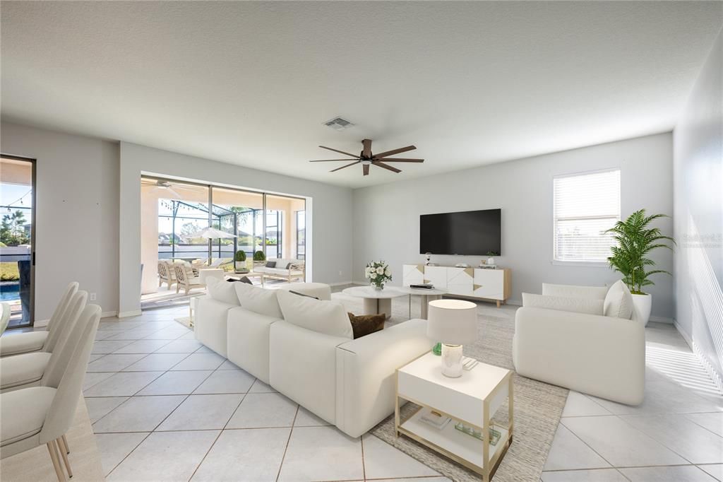 The open living, dining and kitchen are the perfect blend of comfort and style with two sets of sliding glass doors that open up to a large PAVER LANAI and SCREENED POOL for those who seek indoor/outdoor living and entertaining. Virtually Staged.