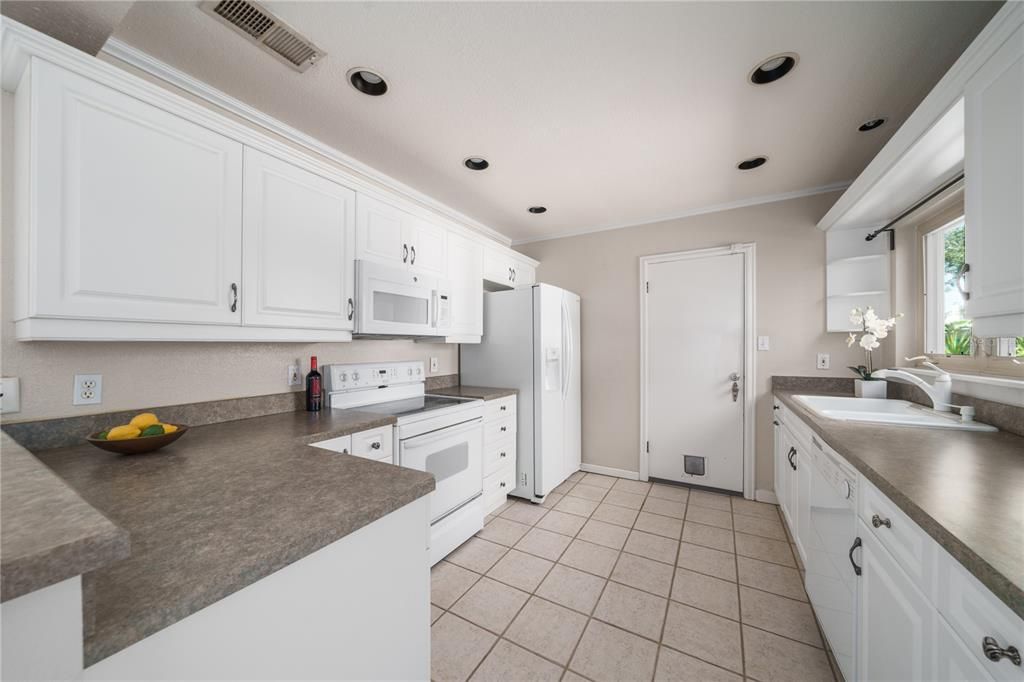 Light and Bright Kitchen door exits to laundry area