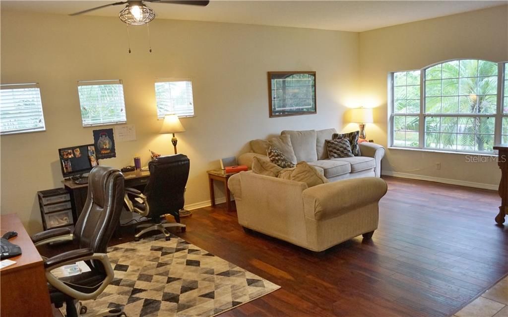 This huge front room can be used many ways and looks out at conservation