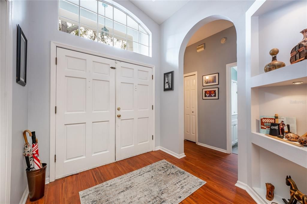 Double entry doors open up to a light and bright flowing floor plan under VAULTED CEILINGS complete with SKYLIGHTS, adorable built-in nooks and there is a WOOD BURNING FIREPLACE at the center of it all.