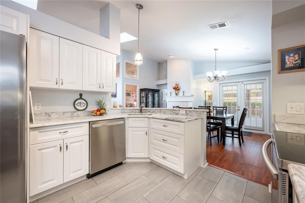 The kitchen has been updated to reflect modern design elements and offers the home chef STAINLESS STEEL APPLIANCES, a great mix of cabinet and drawer storage, closet pantry and there is even a breakfast nook for casual dining.