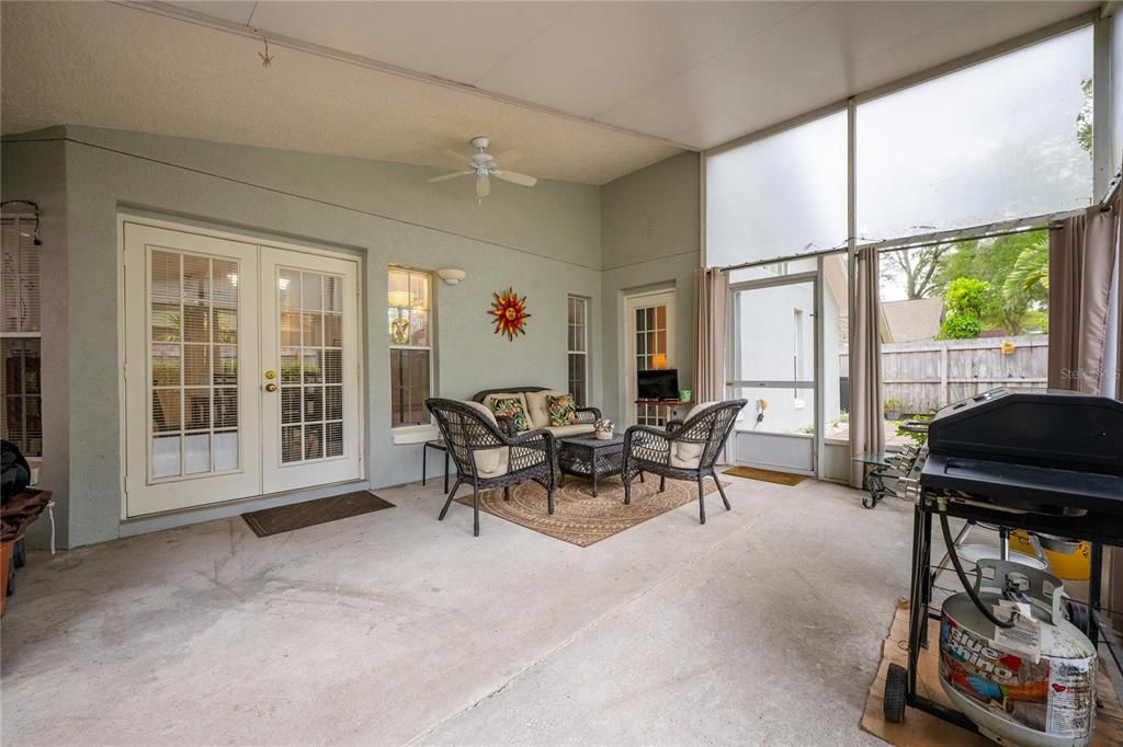 The extended lanai also boasts a vaulted ceiling and plenty of space for outdoor living or dining, overlooking an open paver patio all FULLY FENCED for added privacy.