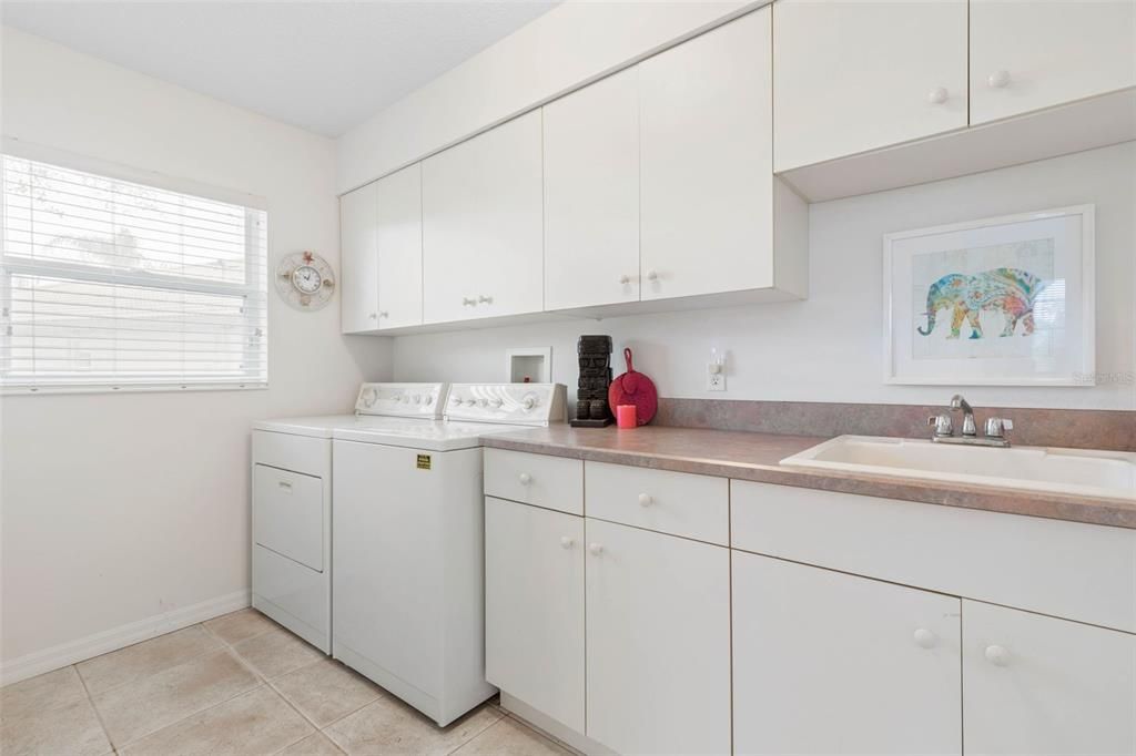 Spacious laundry room with lots of storage!